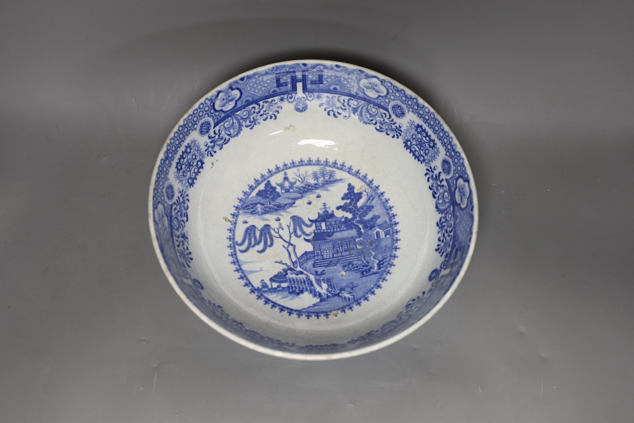 An early 19th century pearlware blue and white punch bowl, 27cm
